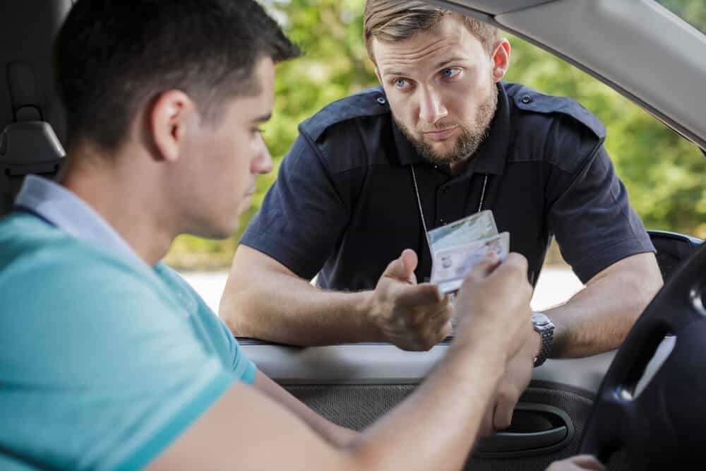 police officer checking drivers license points