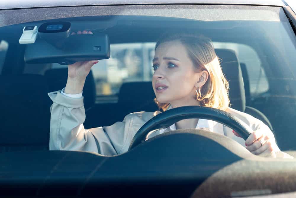 worried girl in car because she is a first time driver