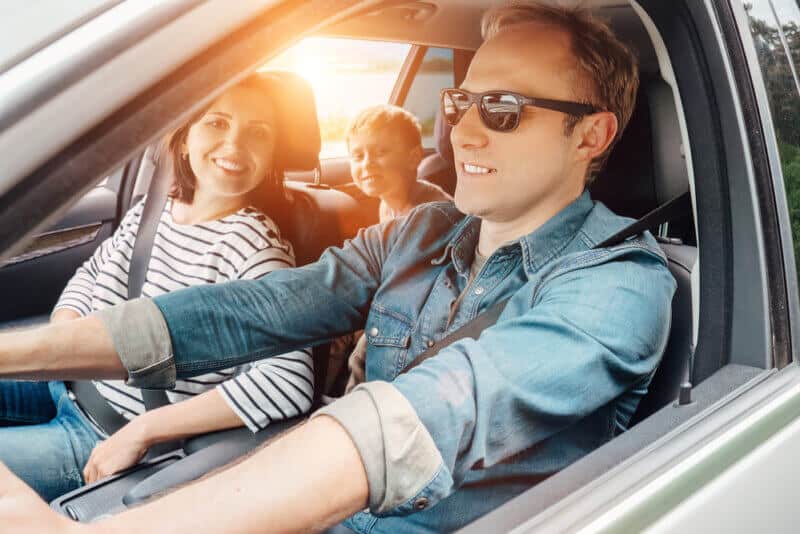 Family,Into,The,Car caucasian family in car on road trip