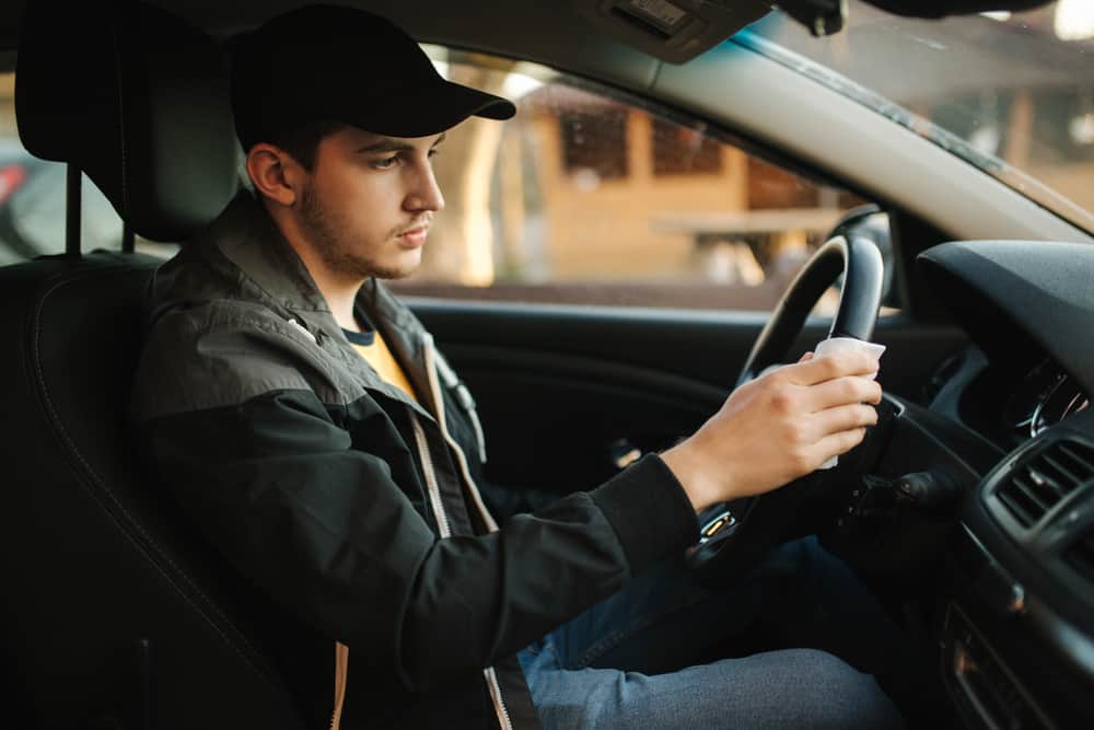 Young man is unhappy in his car