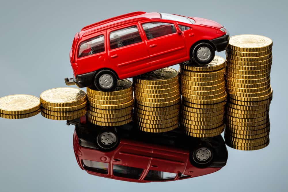 car on top of increasing coins