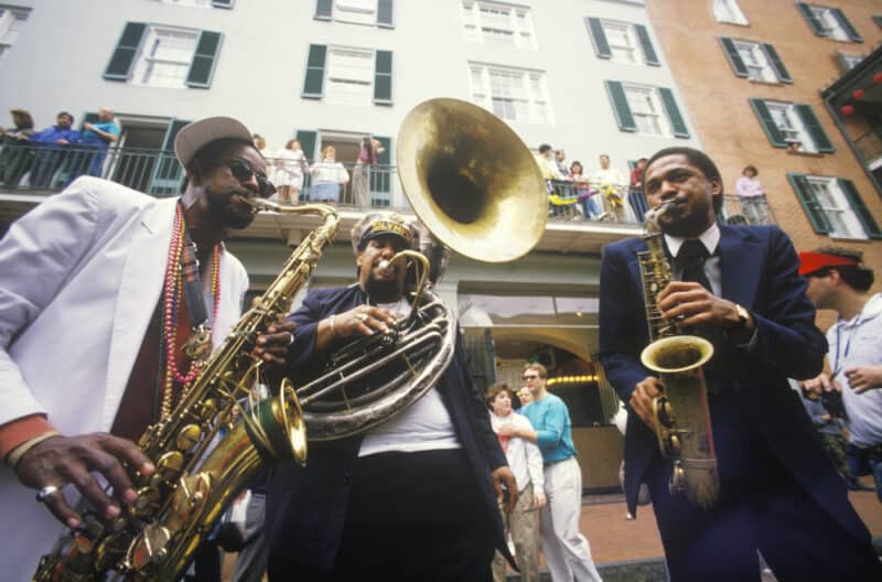 Jazz,Musicians,Performing,On,The,French,Quarter,,New,Orleans,At Band of musicians play during Mardi Gras in New Orleans