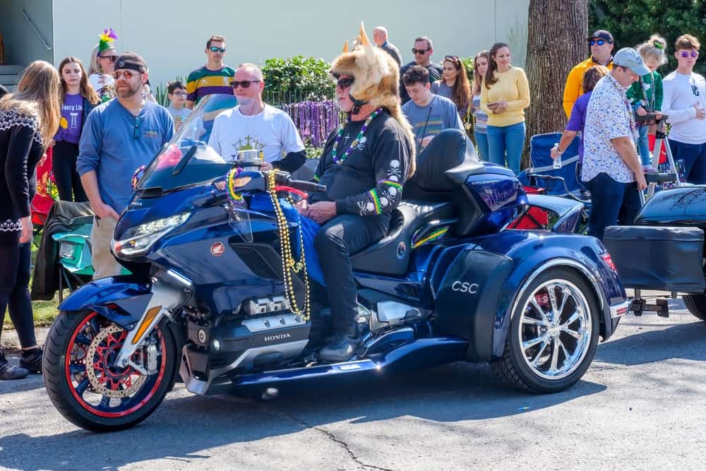 Man rides his motorcycle in a parade during Mardi Gras in New Orleans