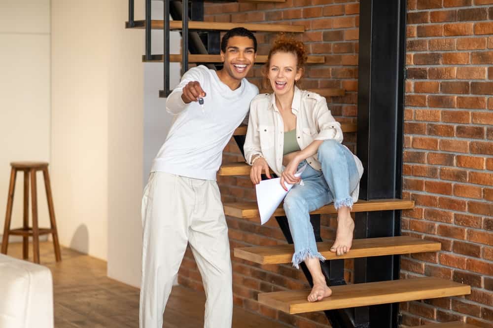Young couple excited to move into their rental home